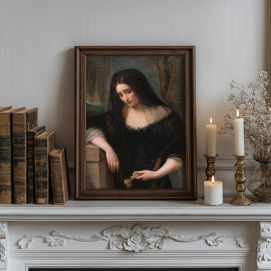 Framed portrait of a woman on a mantelpiece with candles and books.