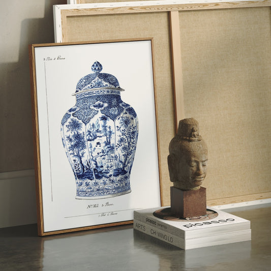 Framed artwork of a blue and white vase next to a sculpture.