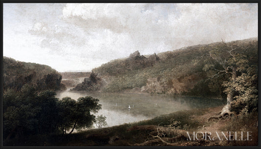 Landscape with a calm lake, green trees, rocky hills, and soft clouds overhead.